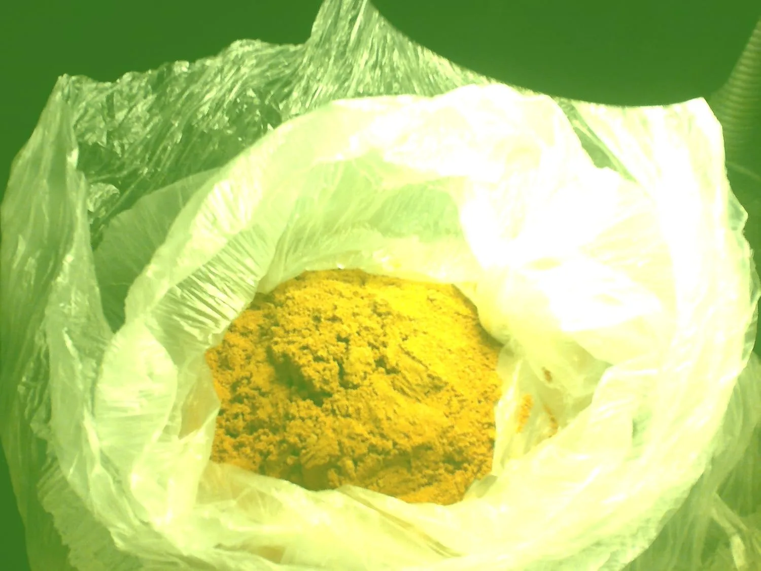 Customer photo of yellow ash residue from calcined herb material in a ceramic crucible